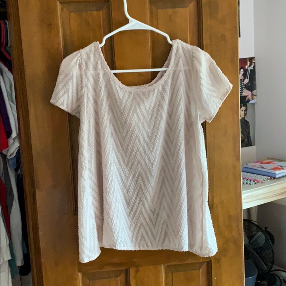 a cream split back blouse
